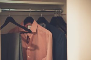 Closet-with clothes-on-hangers