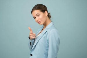 Woman-pointing-and-winking-at-camera