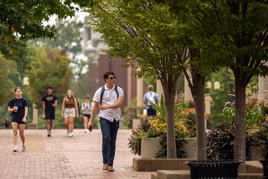 Student-walking-on-Lowry-Mall