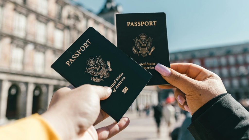 2-hands-holding-passports