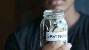 person-holding-savings-jar