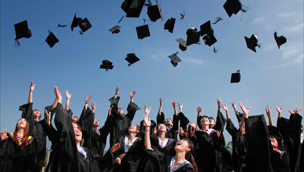 Mortar boards thrown in air