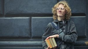 college-studebt-holding-books-with-backpack