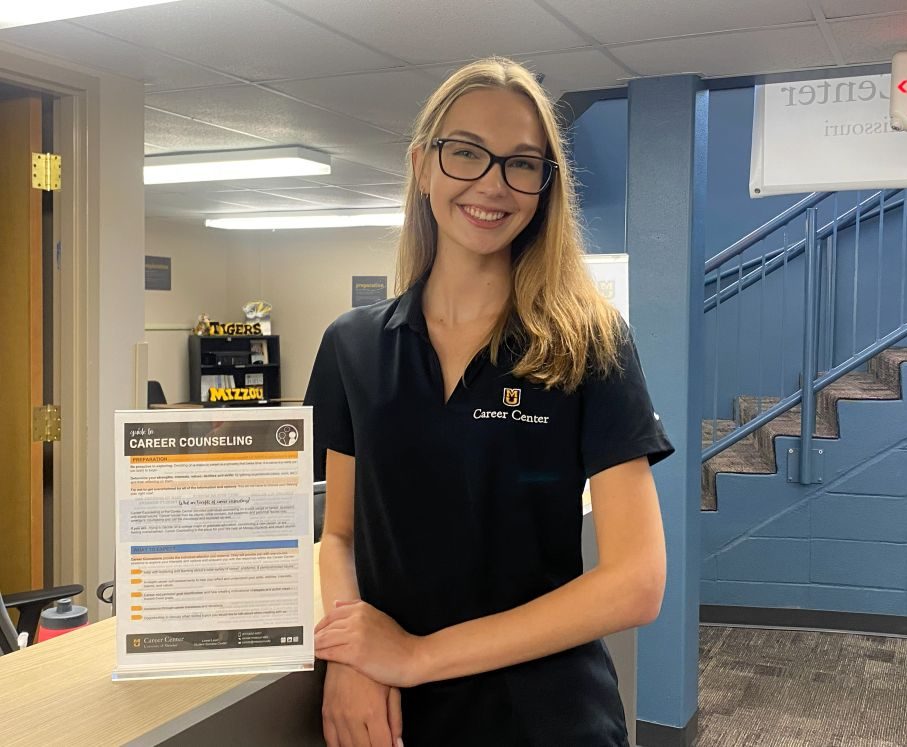 Career Cousnelor smiling by reception desk