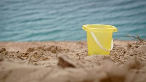 yellow-bucket-on-beach