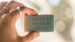 hand-holding-you-can-do-hard-things-sign