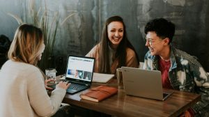 3-interns-laughing-at-table
