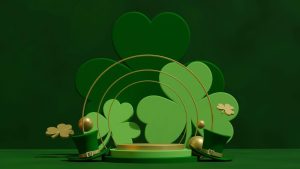 shamrocks behind gold metal rainbow