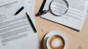 cover-letter-with=coffee-and-magnifying glass