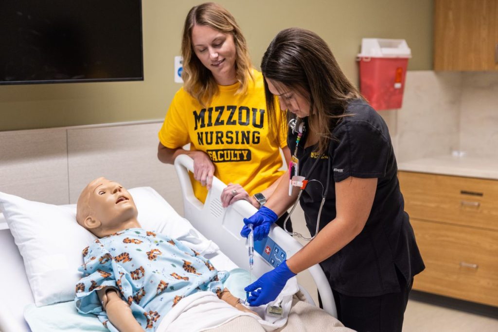 Nursing student doing patient simulation